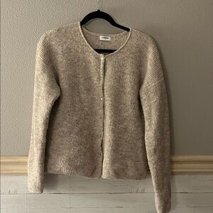 Fuzzy cream colored cardigan